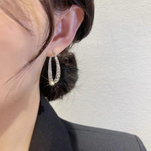 Afbeelding in Gallery-weergave laden, Kruis gebogen oorbellen