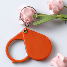 Afbeelding in Gallery-weergave laden, Opvouwbare sleutelhanger met vergrootglas
